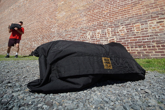 workout sandbags in sun